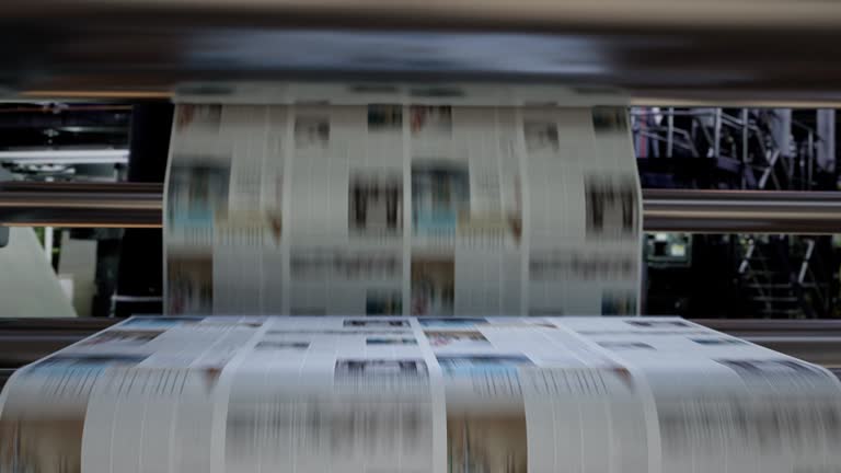 printing press moving fast with paper printing
